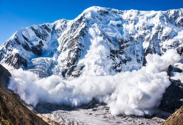 Snow avalanche on a mountain top
